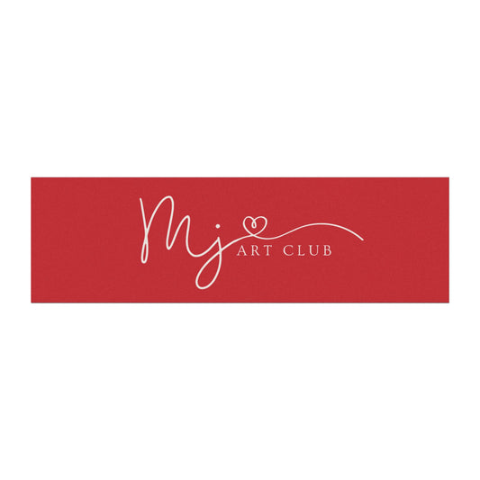 A rectangular red sign or banner with white script reading 'mj' and 'ART CLUB' plus a small heart detail, centered on a light gray background.