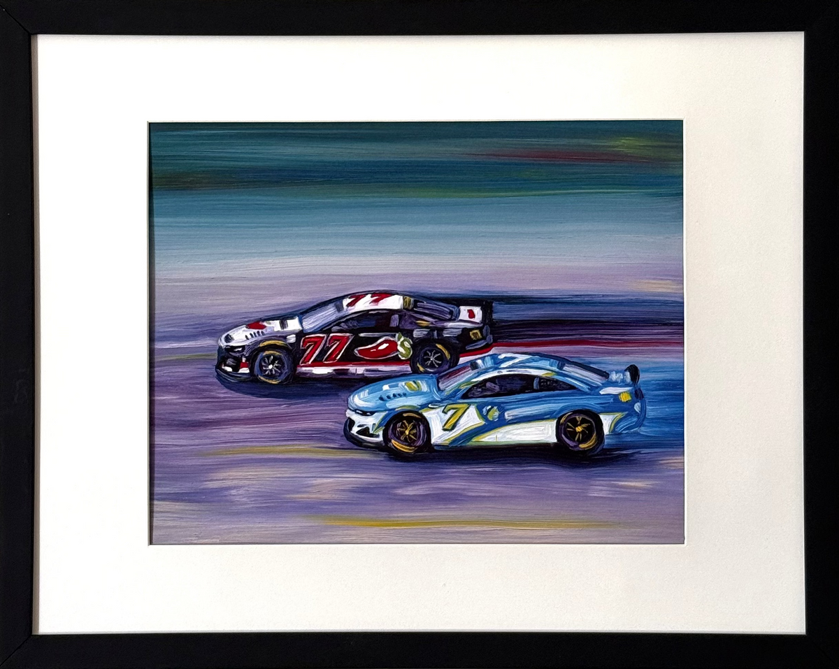 Framed art print of two race cars on a track