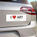 A rectangular white bumper sticker with the text 'I [red heart] ART' and 'MJ ART CLUB' underneath, shown applied to the rear bumper of a silver car.