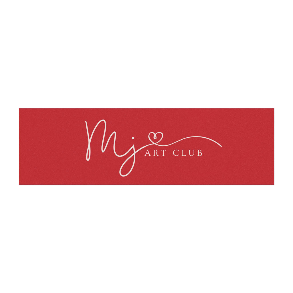A rectangular red sign or banner with white script reading 'mj' and 'ART CLUB' plus a small heart detail, centered on a light gray background.