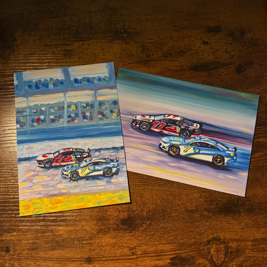 Set of two art cards featuring two race cars on a track