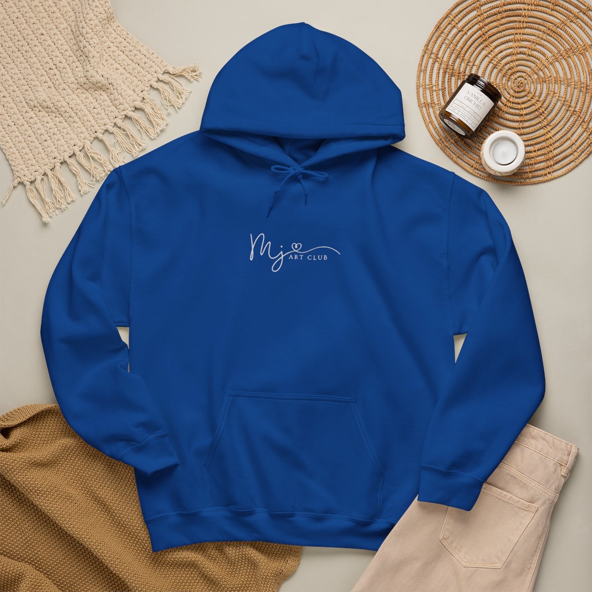 Blue hoodie with 'MJ art club' text on a neutral background