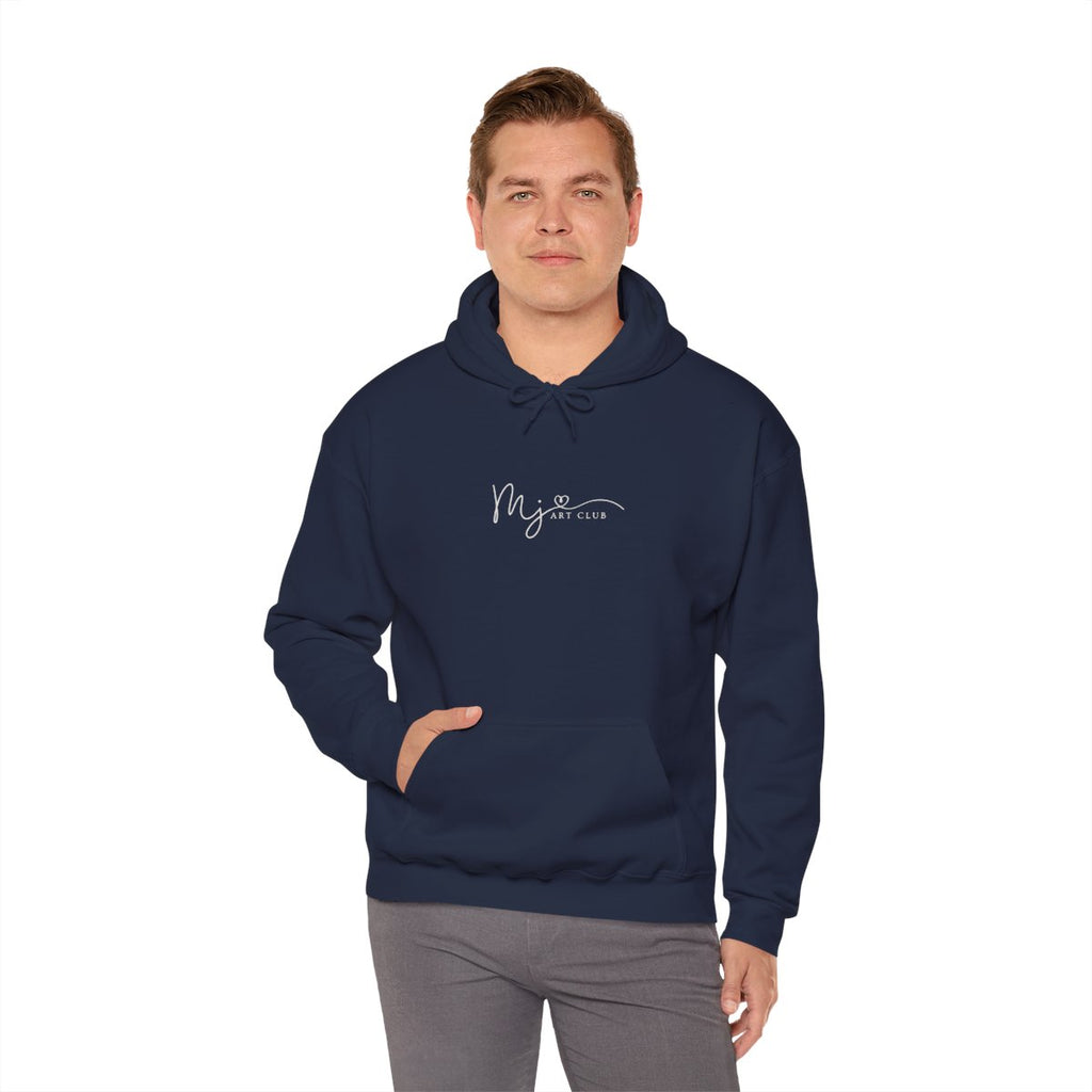 Man wearing a navy blue hoodie with a white logo against a white background