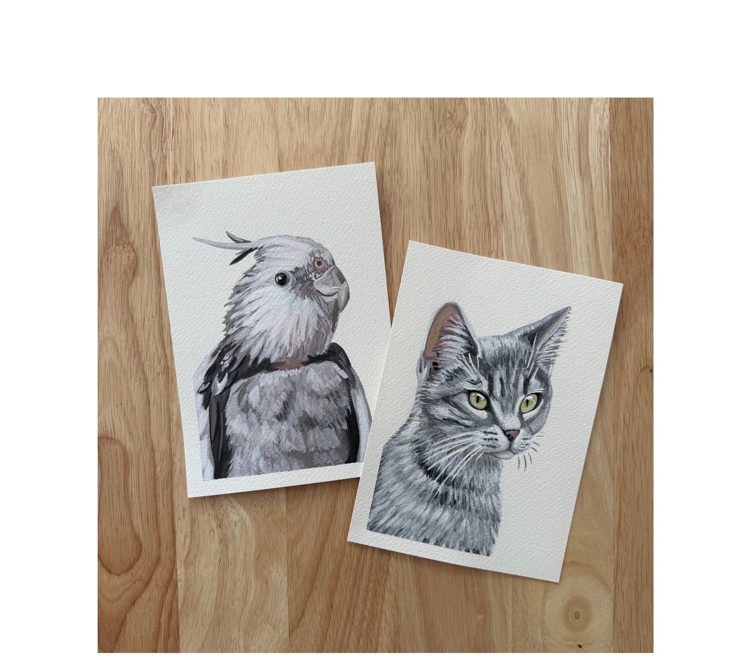 two 5x7 pet portraits on a wood background