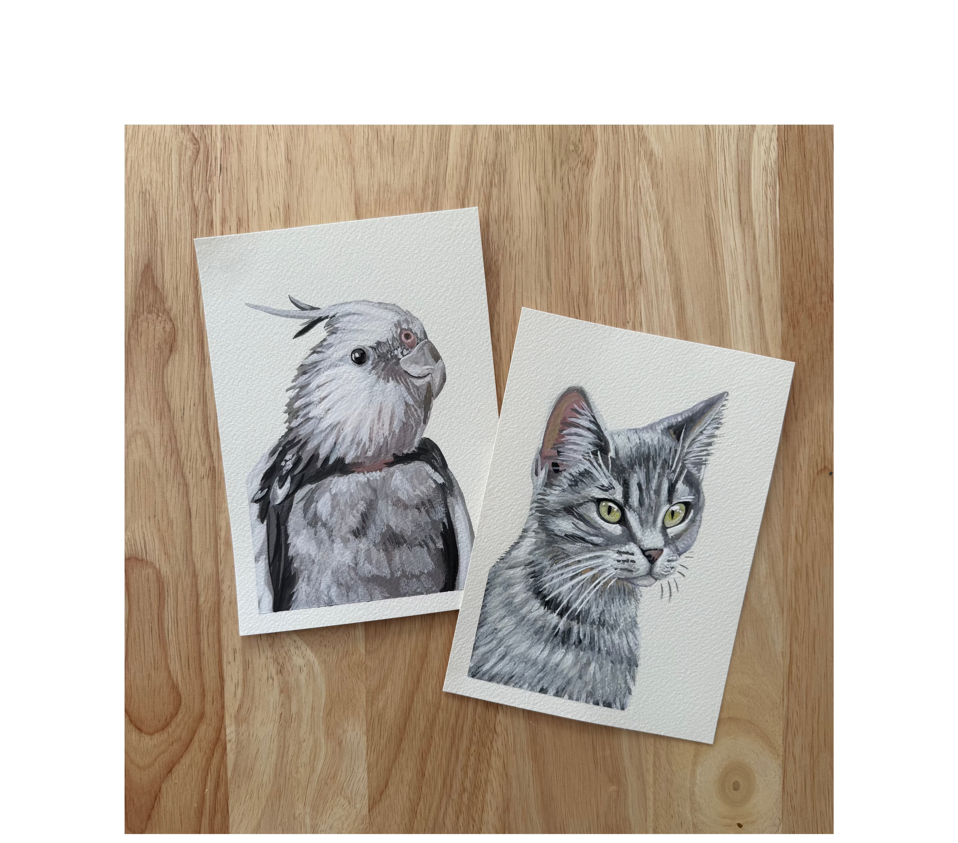 two 5x7 pet portraits on a wood background
