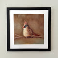 Black frame with white matting including a fine art print of a female cardinal on a branch with a brown bokeh background