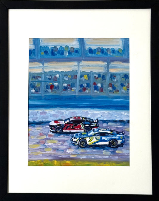 Framed art print of two race cars on a track