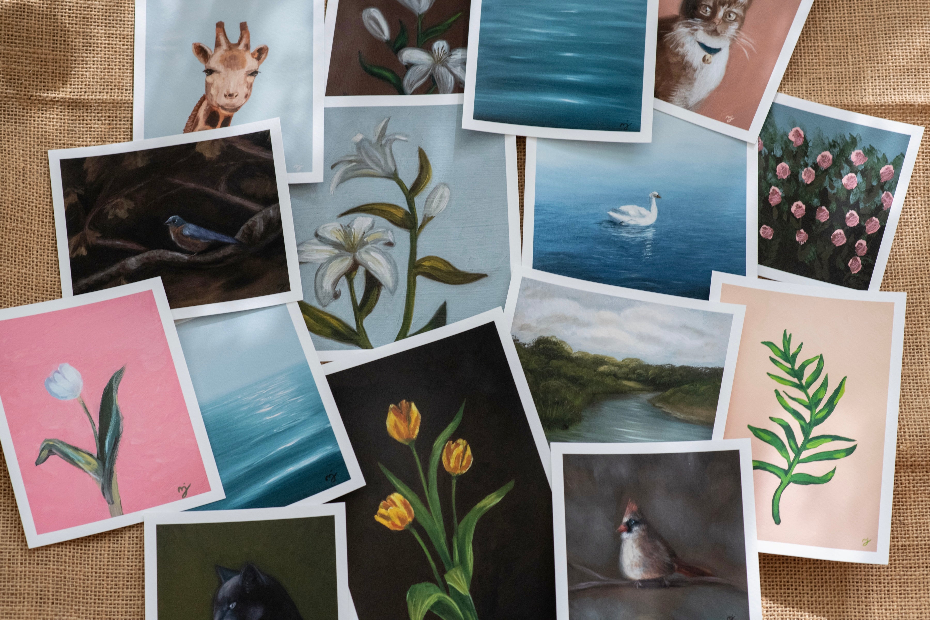 Collection of small printed images on a textured fabric background